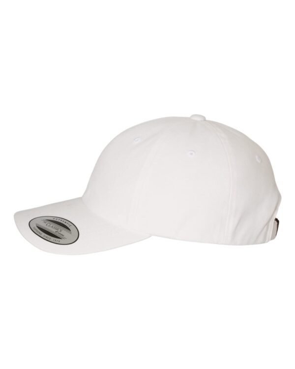 Classic white baseball cap with curved brim and adjustable strap, side view.