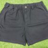Black cotton shorts with elastic waistband and back pocket featuring "Core" branding,