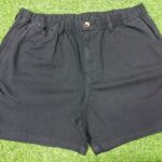 Black cotton shorts with elastic waistband and back pocket featuring "Core" branding,