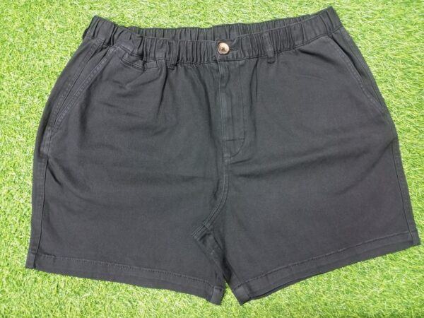 Black cotton shorts with elastic waistband and back pocket featuring "Core" branding,