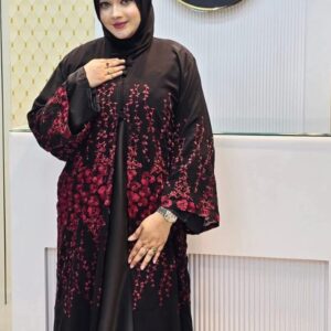 Woman wearing a black Dubai Imported Original Farasha Borka with striking red floral embroidery.