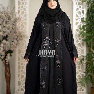 Woman in a black premium 2-part koti borka featuring intricate embroidered patterns and matching hijab.