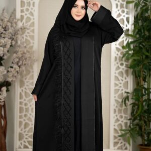 Woman wearing a black premium 2-part koti borka with intricate front detailing and matching hijab.