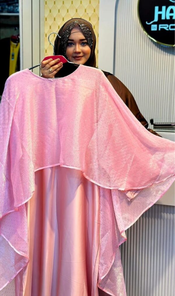 Stone Organza Armani Silk Borka. Woman showcasing a pink stone organza Armani silk borka with elegant layered design.